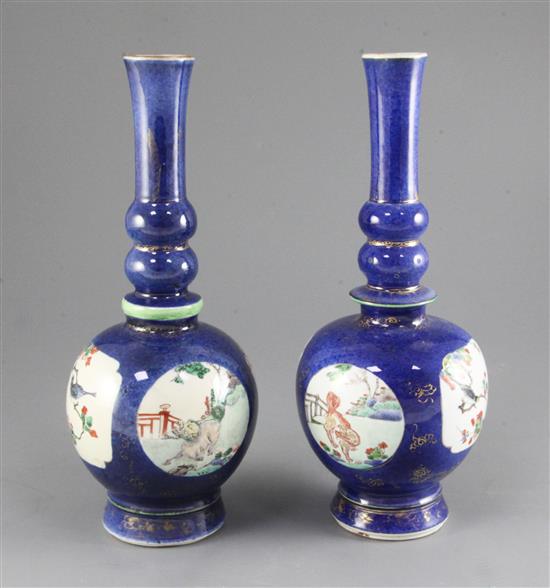 Two similar Chinese powder blue ground famille verte bottle vases, Kangxi period, height 27.7cm